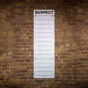 Mugshot height chart on a brick wall with centimetres 